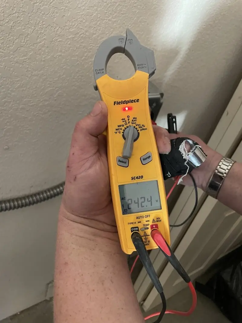 Voltage testing with clamp meter during Ceiling Fan Installation in Beltsville